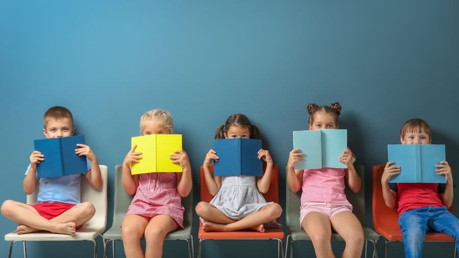 Happy children and teachers in a nurturing preschool environment